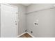 Functional laundry room with storage shelf and connections for a washer and dryer at 1023 Saint Augustine Pkwy, Locust Grove, GA 30248