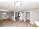 Open-concept living room showcases light wood floors, neutral paint, and abundant natural light at 1023 Saint Augustine Pkwy, Locust Grove, GA 30248
