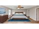Main bedroom with modern furniture, fresh paint, laminate floors and natural light at 1023 Saint Augustine Pkwy, Locust Grove, GA 30248