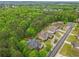 Expansive aerial view showcasing the home nestled amongst lush green trees and a well-maintained neighborhood at 1985 Chapel Estates Ln, Dacula, GA 30019