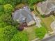 Aerial view of a beautifully landscaped home with a pool, shed, and lush greenery at 1985 Chapel Estates Ln, Dacula, GA 30019