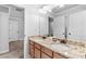 Bathroom featuring a double vanity with granite countertop and modern fixtures at 1985 Chapel Estates Ln, Dacula, GA 30019