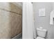 Bathroom featuring a shower with tile and toilet at 1985 Chapel Estates Ln, Dacula, GA 30019