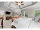 The primary suite boasts a spacious sitting area with a TV and lovely backyard views at 1985 Chapel Estates Ln, Dacula, GA 30019