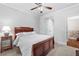 Comfortable bedroom featuring neutral walls, a ceiling fan, and a view to another bedroom at 1985 Chapel Estates Ln, Dacula, GA 30019