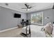 Bedroom with a ceiling fan, workstation, and large window at 1985 Chapel Estates Ln, Dacula, GA 30019