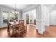 Inviting dining room with wood floors and large windows that bring in plenty of natural light at 1985 Chapel Estates Ln, Dacula, GA 30019