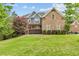 Beautiful brick home with a well-manicured lawn and mature trees creating an inviting curb appeal at 1985 Chapel Estates Ln, Dacula, GA 30019