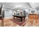 Spacious game room features a pool table, hardwood floors and a wet bar for entertaining at 1985 Chapel Estates Ln, Dacula, GA 30019