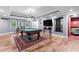 Spacious game room with a pool table, hardwood floors, and access to the back yard at 1985 Chapel Estates Ln, Dacula, GA 30019