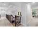 Hallway with railing overlooking living room at 1985 Chapel Estates Ln, Dacula, GA 30019
