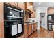 Updated kitchen features stainless steel appliances and wood cabinets and granite countertops at 1985 Chapel Estates Ln, Dacula, GA 30019