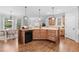 Well-lit kitchen boasts granite countertops, stainless steel appliances, and an open floor plan at 1985 Chapel Estates Ln, Dacula, GA 30019