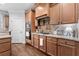 Kitchen features wood cabinets, granite countertops, and stainless steel oven and microwave at 1985 Chapel Estates Ln, Dacula, GA 30019