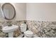 Charming powder room with decorative wall tiles and a modern sink at 1985 Chapel Estates Ln, Dacula, GA 30019