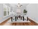 Bright sitting room with hardwood floors, modern decor, and a ceiling fan at 1985 Chapel Estates Ln, Dacula, GA 30019