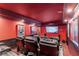 Cozy theater room with plush seating, a large screen, and themed decor for an immersive cinematic experience at 1985 Chapel Estates Ln, Dacula, GA 30019