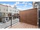 Balcony with wood floors and privacy screen overlooking other homes at 2329 Mason Dr # D24, Atlanta, GA 30316