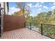 Spacious balcony with wood flooring overlooking a wooded area at 2329 Mason Dr # D24, Atlanta, GA 30316