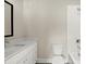 Bright bathroom features a white vanity, toilet and shower-tub combo with white tiled walls at 2329 Mason Dr # D24, Atlanta, GA 30316