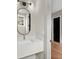 Bathroom features a white quartz vanity and decorative oval mirror at 2329 Mason Dr # D24, Atlanta, GA 30316