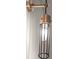 Stylish bathroom light fixture with brass finish and cylindrical glass shade at 2329 Mason Dr # D24, Atlanta, GA 30316