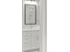 Bathroom featuring a modern shower head, white vanity, and a large mirror with a black frame at 2329 Mason Dr # D24, Atlanta, GA 30316