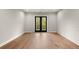 Bedroom with hardwood floors, ceiling fan, and balcony access at 2329 Mason Dr # D24, Atlanta, GA 30316