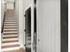 Entryway featuring staircase with hardwood steps and black interior door at 2329 Mason Dr # D24, Atlanta, GA 30316