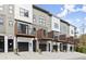 Townhome row features modern design, elevated balconies, and garages for convenient city living at 2329 Mason Dr # D24, Atlanta, GA 30316