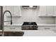 Bright kitchen with modern stainless steel appliances, quartz countertops, and white cabinets at 2329 Mason Dr # D24, Atlanta, GA 30316