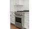 This updated kitchen features stainless steel appliances, modern fixtures, and white cabinets at 2329 Mason Dr # D24, Atlanta, GA 30316