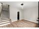 Bright living room features stairs, wood floors, and modern lighting fixtures at 2329 Mason Dr # D24, Atlanta, GA 30316