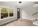 Bright living room features stairs, wood floors, and backyard view at 2329 Mason Dr # D24, Atlanta, GA 30316