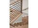 Beautiful staircase with hardwood steps, black metal railing, and natural wood handrail at 2329 Mason Dr # D24, Atlanta, GA 30316