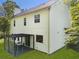 Backyard showcasing outdoor seating, a well-maintained lawn, and a door to the home at 429 Tannenhill Pl, Sugar Hill, GA 30518