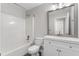 Bathroom with white cabinets, mirror and combined shower and tub at 429 Tannenhill Pl, Sugar Hill, GA 30518