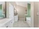 Bright bathroom featuring a soaking tub, glass shower, and double vanity at 429 Tannenhill Pl, Sugar Hill, GA 30518