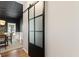 Dining area with an eye-catching barn door that can be closed for privacy at 429 Tannenhill Pl, Sugar Hill, GA 30518