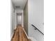 Hallway with hard wood floors leading to other rooms at 429 Tannenhill Pl, Sugar Hill, GA 30518