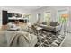 Open floorplan with a living room and kitchen featuring lots of light and modern finishes at 429 Tannenhill Pl, Sugar Hill, GA 30518