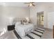 Comfortable bedroom with natural light, a ceiling fan, and an ensuite bathroom at 429 Tannenhill Pl, Sugar Hill, GA 30518