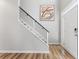 The foyer has a modern staircase with an abstract art piece at 429 Tannenhill Pl, Sugar Hill, GA 30518