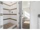 Modern walk-in shower with white subway tile and contrasting gray accents, adjacent to the bedroom at 102 Dahlia Nw Ave, Atlanta, GA 30314