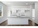 Bright kitchen with granite countertops, modern finishes, and plenty of cabinet space at 102 Dahlia Nw Ave, Atlanta, GA 30314