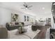 Open concept living room with modern decor and updated kitchen with stainless steel appliances at 102 Dahlia Nw Ave, Atlanta, GA 30314