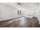 Bright, open-concept living space with hardwood floors, kitchen and neutral color palette at 102 Dahlia Nw Ave, Atlanta, GA 30314