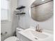 Cozy bathroom featuring a single sink, floating shelves, and modern fixtures at 1599 Ezra Church Nw Dr, Atlanta, GA 30314