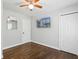 Bedroom boasts hardwood floors, a ceiling fan, and a mounted television for comfortable living at 1599 Ezra Church Nw Dr, Atlanta, GA 30314