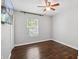 Bedroom featuring hardwood floors, a window and ceiling fan, with bright natural light at 1599 Ezra Church Nw Dr, Atlanta, GA 30314